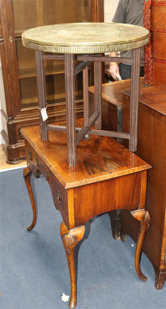 A walnut writing table and a folding table with brass top W.78cm and 60cm